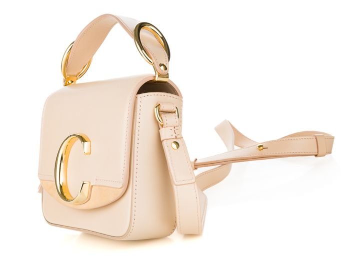 Chloe C Crossbody Bag  About Chloe* Chloé is a French luxury fashion house founded in 1952 by Gaby Aghion. During the next year of 1953 Aghion joined forces with Jacques Lenoir, formally managing the business side of the brand, allowing Aghion to purely pursue the creative growth of Chloé. Its headquarters are in Paris, France. The house is owned by luxury brands holding company Richemont Group. Chloé has been worn by many celebrities, including Marion Cotillard, Sienna Miller, Madonna, January Jones, Maggie Gyllenhaal, Cameron Diaz, Emma Stone, Clémence Poésy and Katie Holmes. The brand is characterized by a youthful and bohemian aesthetic and has produced several successful fragrances. Source Wikipedia: Chloe View our other Chloe bags